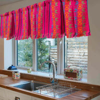Mexican valance, fuchsia, hot pink with fringes, embroidered, on a kitchen window