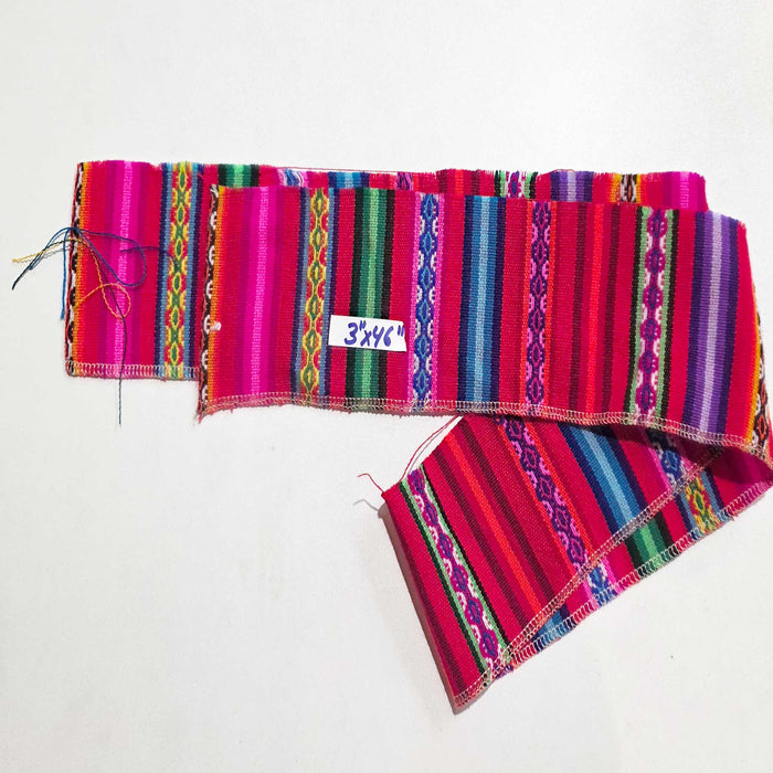 Colorful woven fabric with a visible brand label on a white background