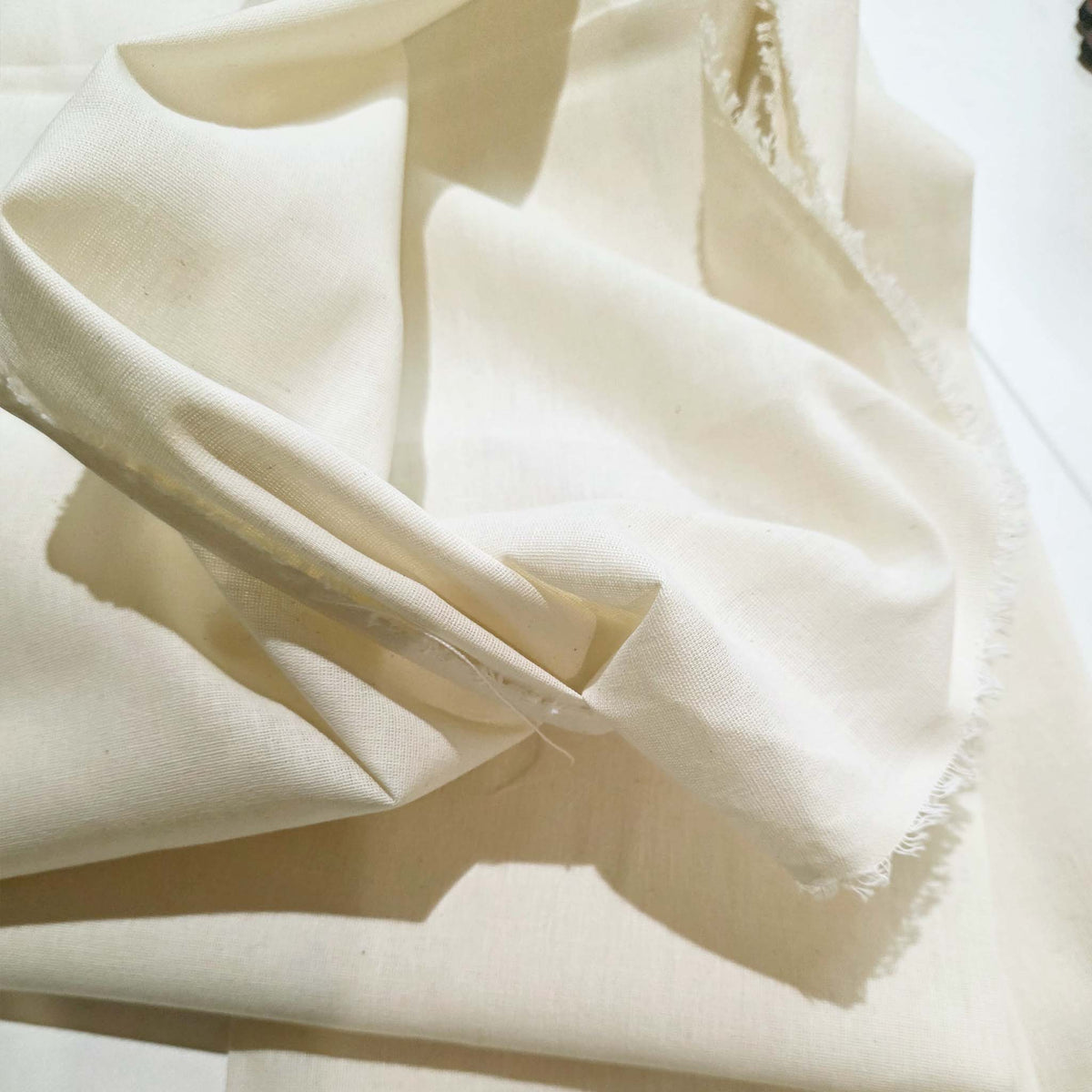 Close-up of beige fabric with a soft texture