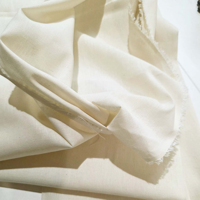 Close-up of beige fabric with a soft texture