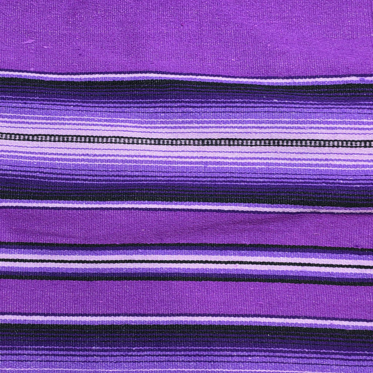 Close-up of purple fabric with black and white stripes