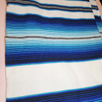 White serape on table, table runner, white and blue, artisan