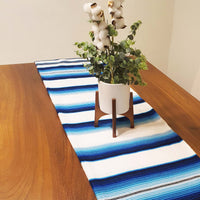 White serape on table, table runner, white and blue, artisan