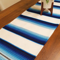 White serape on table, table runner, white and blue, artisan