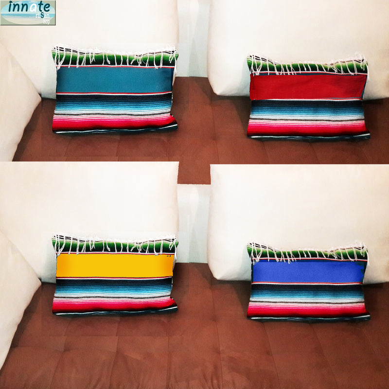 Colorful striped pillows on a sofa with 'innate' branding in the corner.