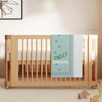 baby blanket, personalized, over a crib rail