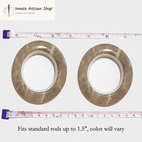 Two metallic washers with a ruler showing their size on a white background, branded 'Innate Artisan Shop'.