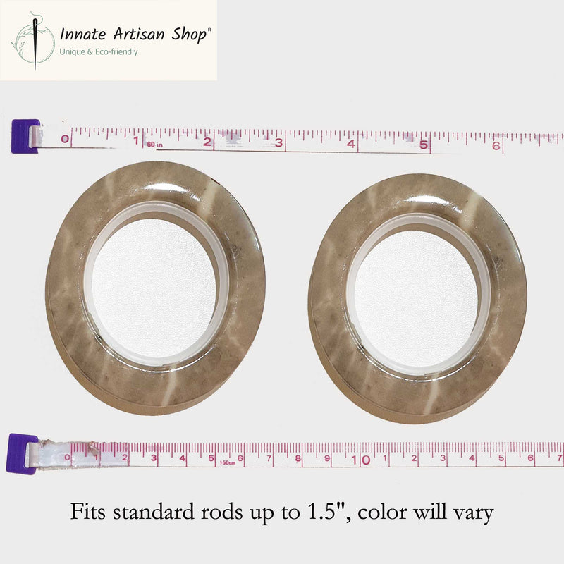 Two metallic washers with a ruler showing their size on a white background, branded 'Innate Artisan Shop'.