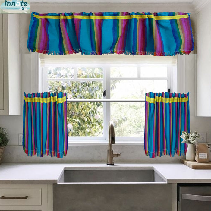 Colorful striped kitchen window valance and two matching tier curtains hanging around a sink window in a bright kitchen.
