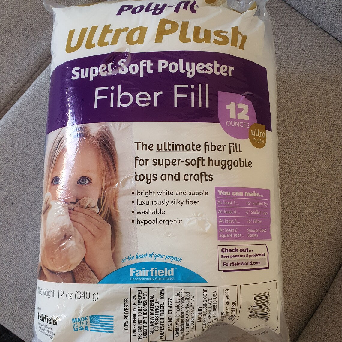 Package of Ultra Plush Super Soft Polyester Fiber Fill on a carpeted floor