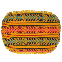 Colorful woven placemat with geometric pattern on a white background