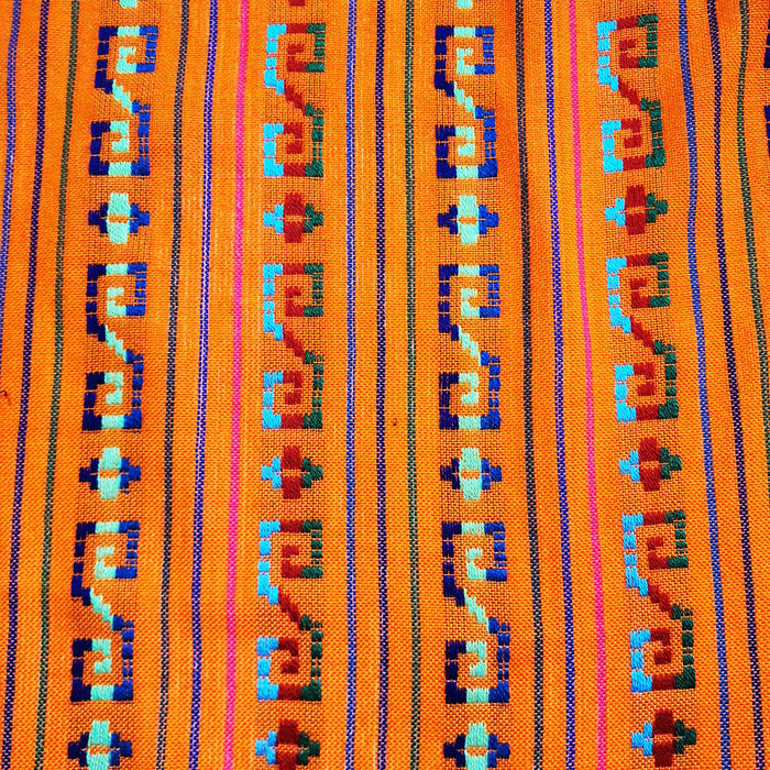 Textile with geometric pattern on an orange background