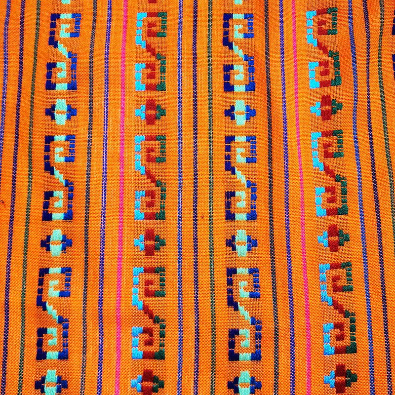 Textile with geometric pattern on an orange background