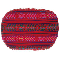 Red woven mat with colorful patterns on a white background