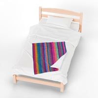 fleece blanket, gender neutral, purple stripes, throw blanket, on top of single size bed
