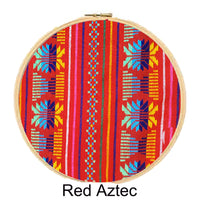 Embroidery hoop with Red Aztec pattern on a white background