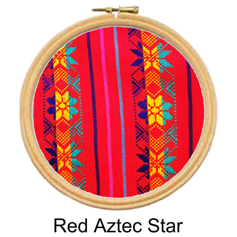 Embroidery hoop with red fabric featuring Aztec star pattern on a white background
