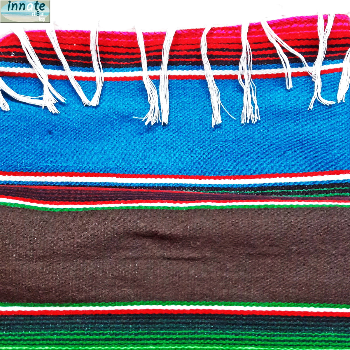 Colorful woven fabric with red, blue, green, and white stripes on a white background.