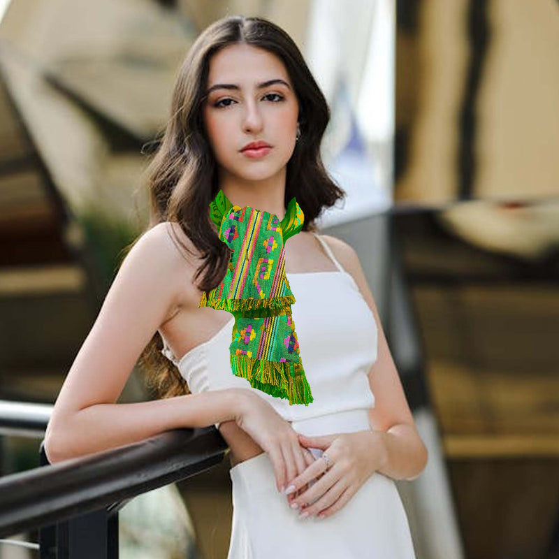 Woman wearing a colorful top and white skirt with blurred background