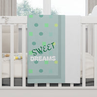 baby blanket, personalized, over a crib rail